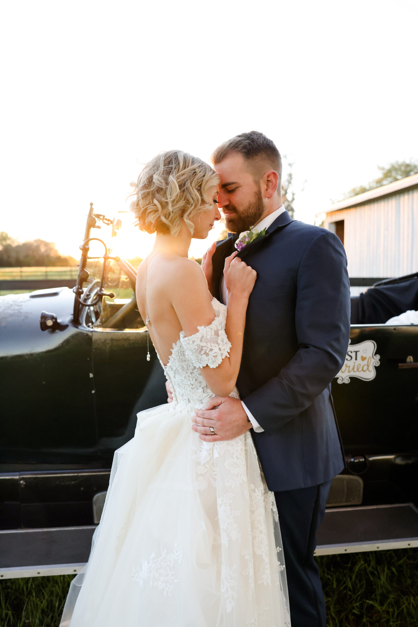 Bride and Groom Classic Getaway Car Wedding Portrait | Tampa Bay Wedding Venue Legacy Lane Weddings | Dress Truly Forever Bridal | Photographer Lifelong Photography | Hair and Makeup Adore Bridal