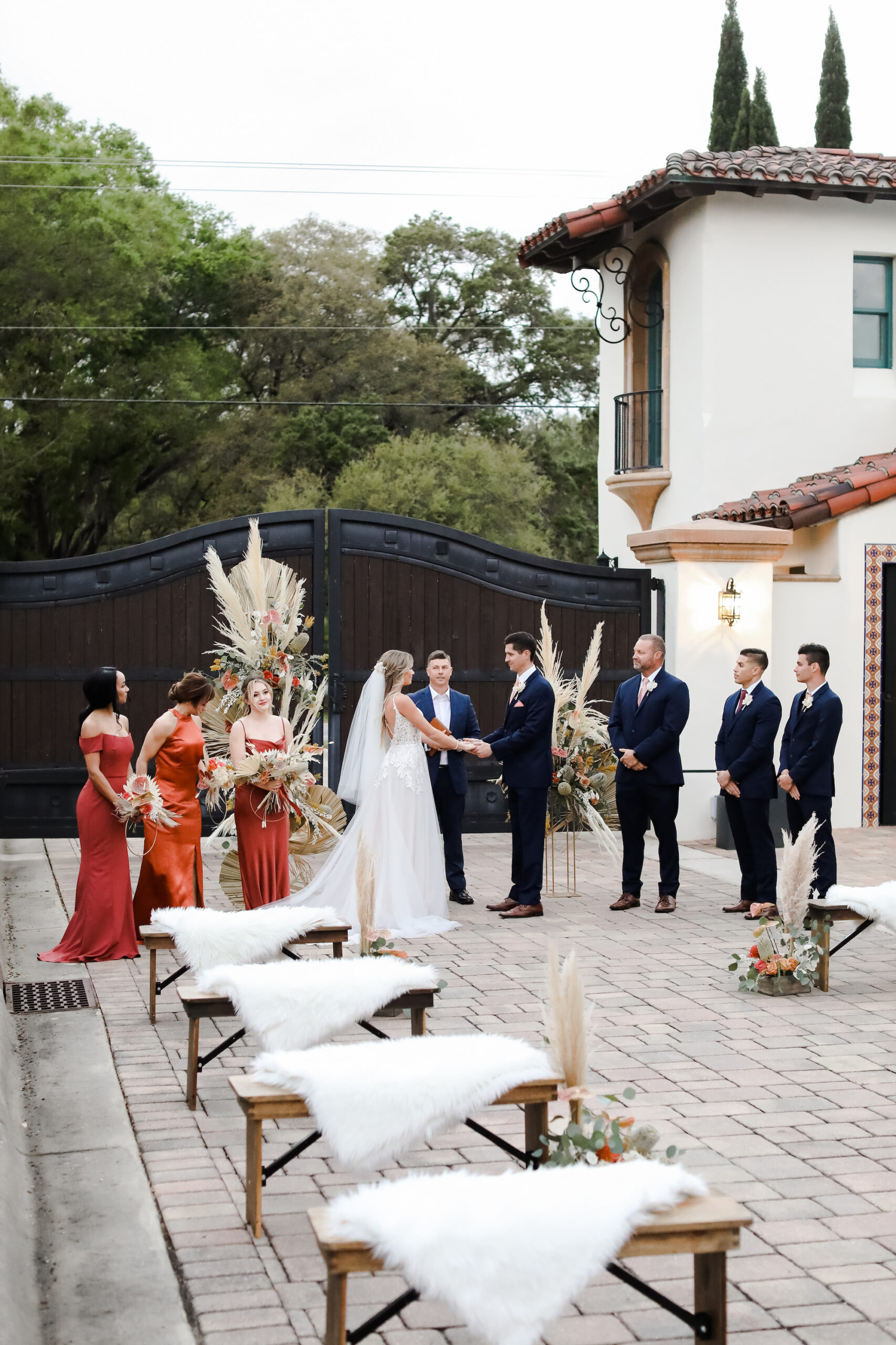 Outdoor Boho Winter Wedding Ceremony with Wooden Benches and Fur | Tampa Bay Wedding Venue Mision Lago Estate | Rentals Gabro Event Services
