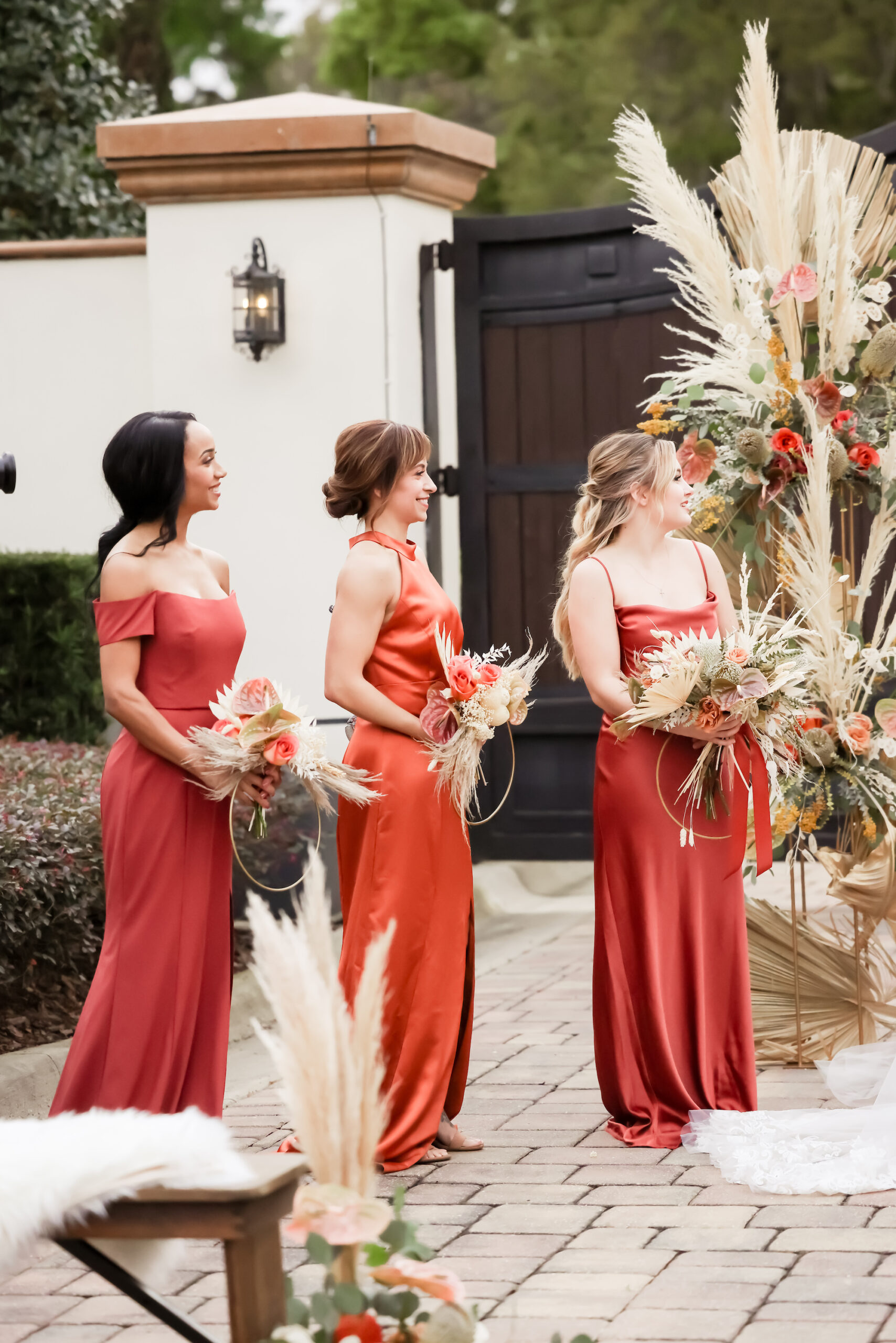 Bridesmaids in Fall Reds and Orange Terracotta Mix and Match Floor Length Dresses and Unique Circle Boho Wedding Bouquets | Bella Bridesmaids Tampa