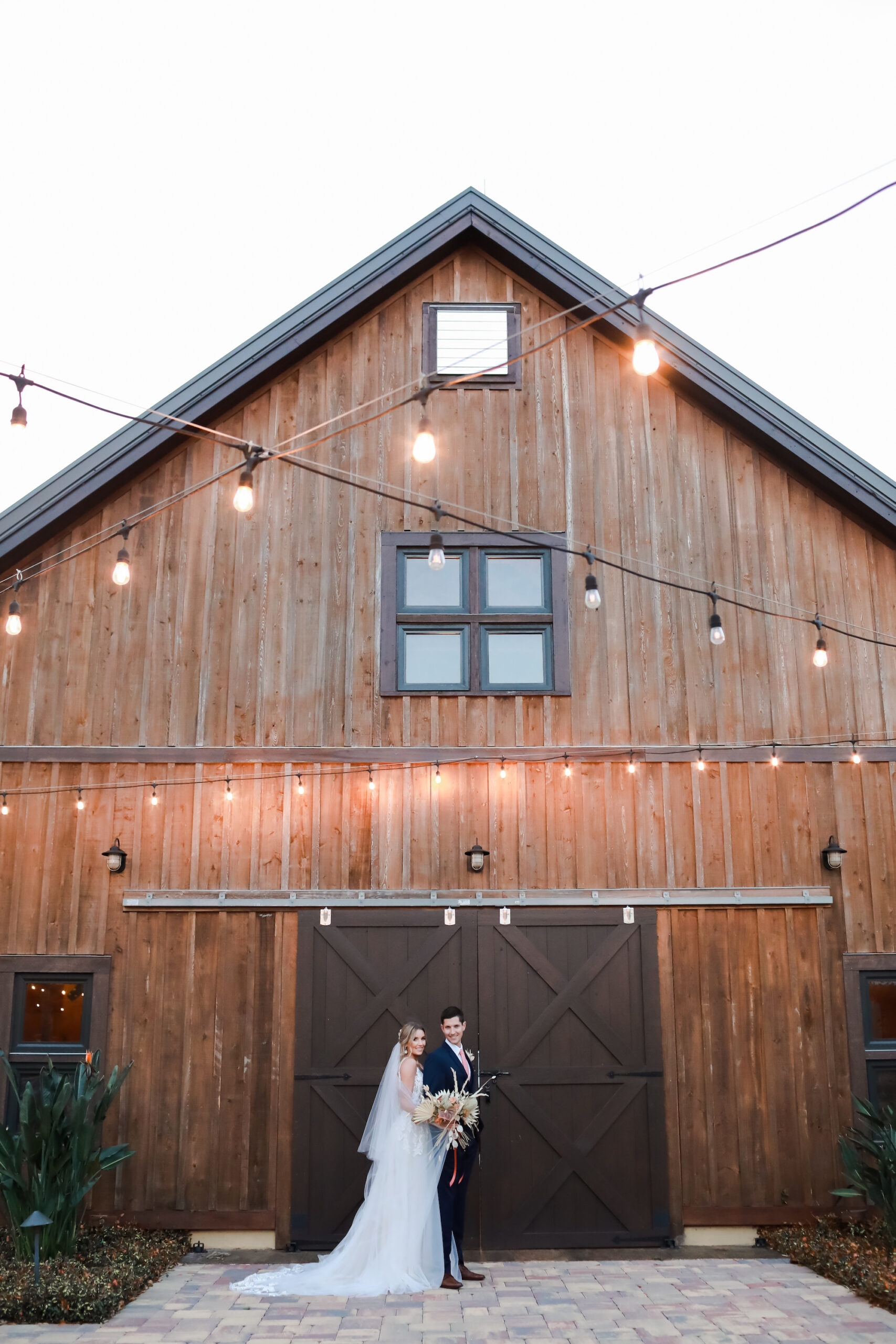 Bride and Groom Wedding Portrait in Front of Barn | Tampa Bay Photographer Lifelong Photography Studio | Venue Mision Lago Estate