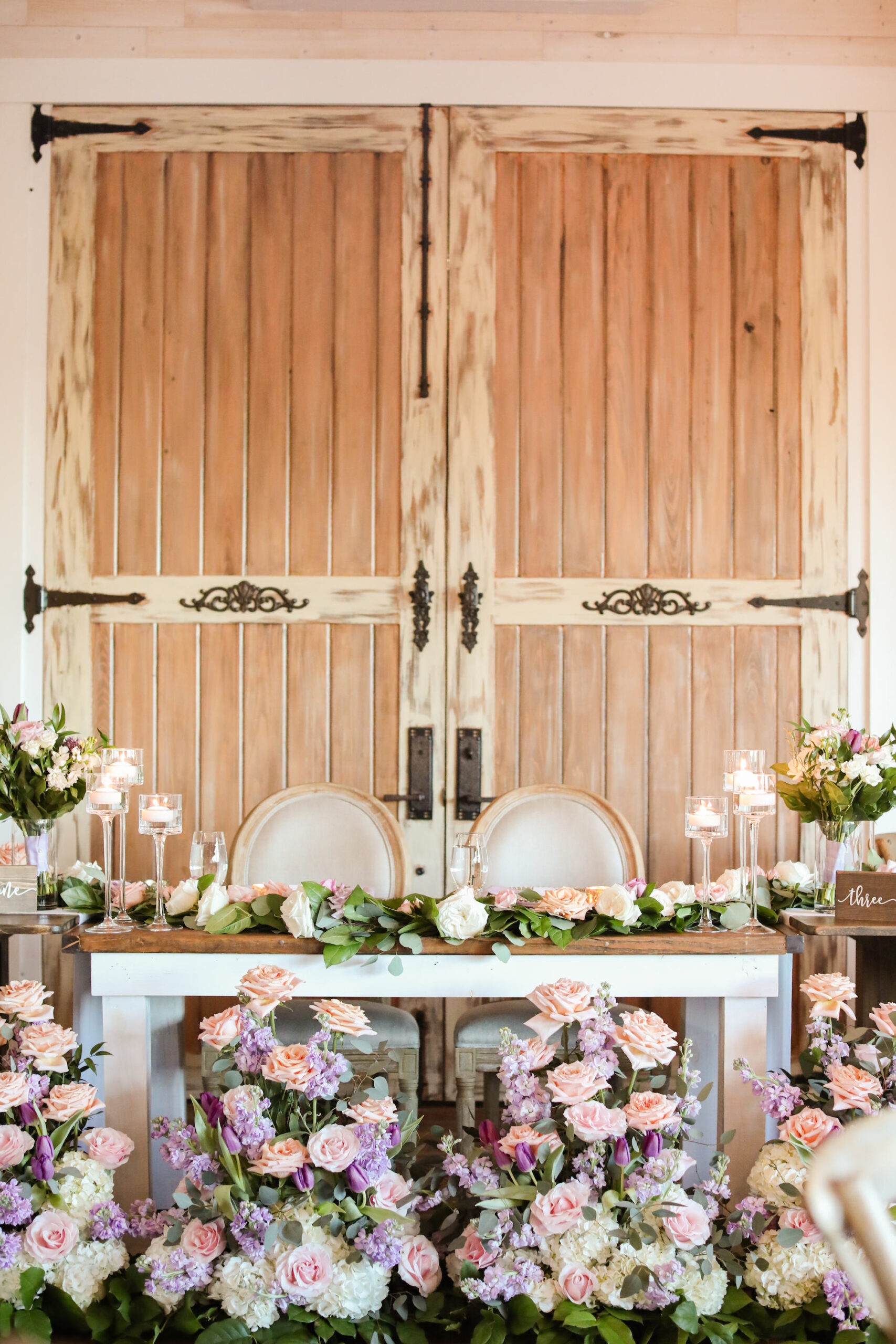 Southern Vintage Blush Rose, White Hydrangea, and Purple Tulip Wedding Reception Sweetheart Table Inspiration