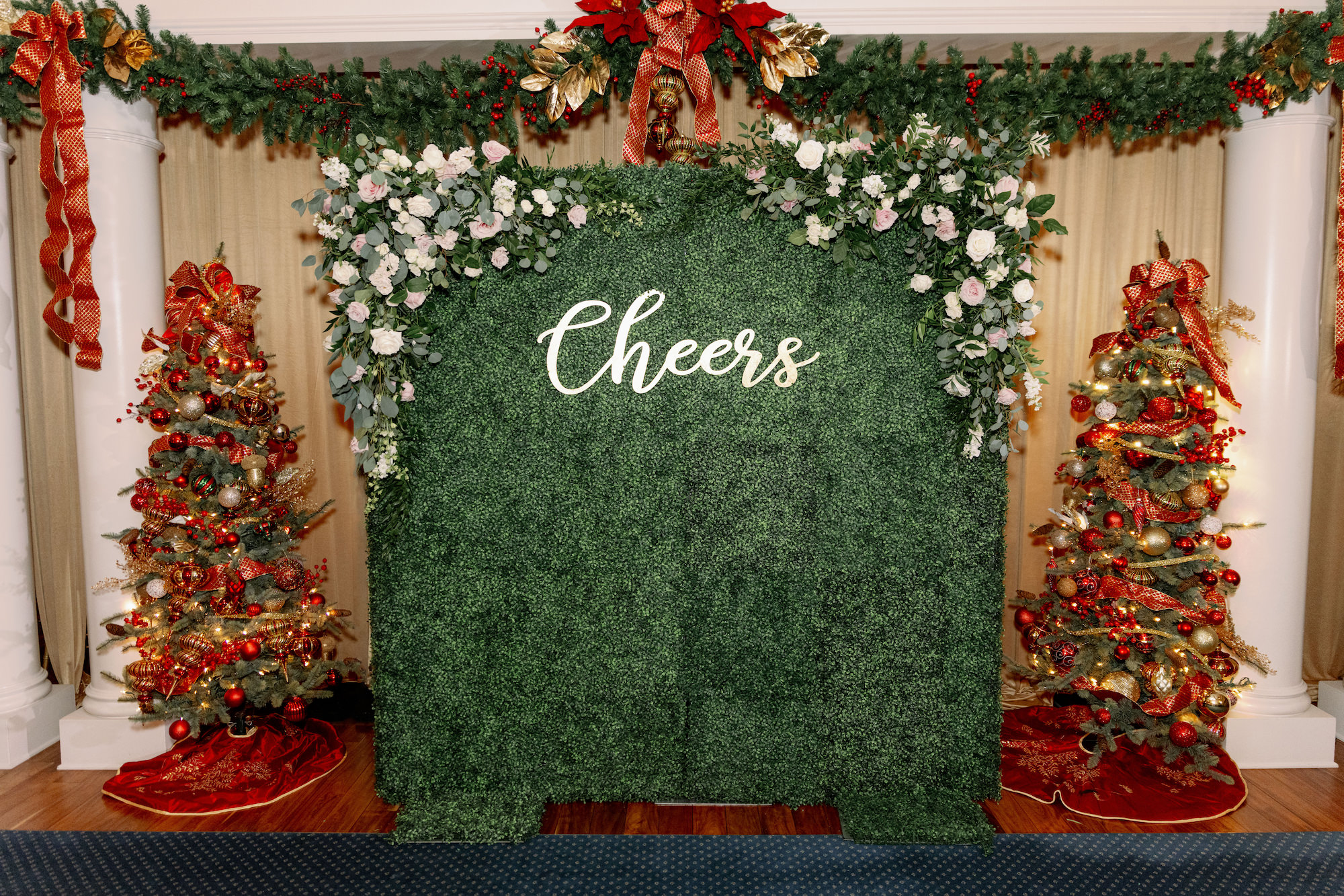 Cheers White Flowers and Eucalyptus Christmas Wedding Greenery Backdrop | Tampa Bay Florist Monarch Events and Design
