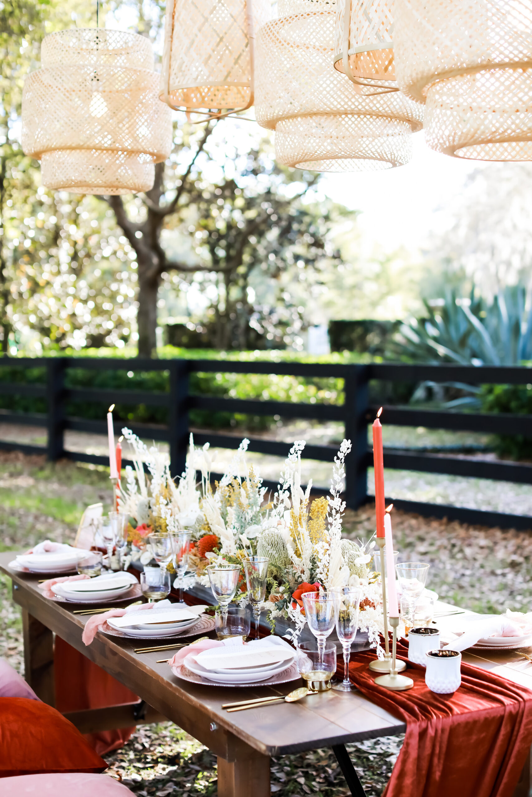Boho Styled Wicker Lanterns Outdoor Wedding Decor Inspiration Boho Picnic with and Fall Reception Tablescape with Wooden Farm Table and Benches Centerpiece Inspiration | Tampa Bay Rentals Gabro Event Services