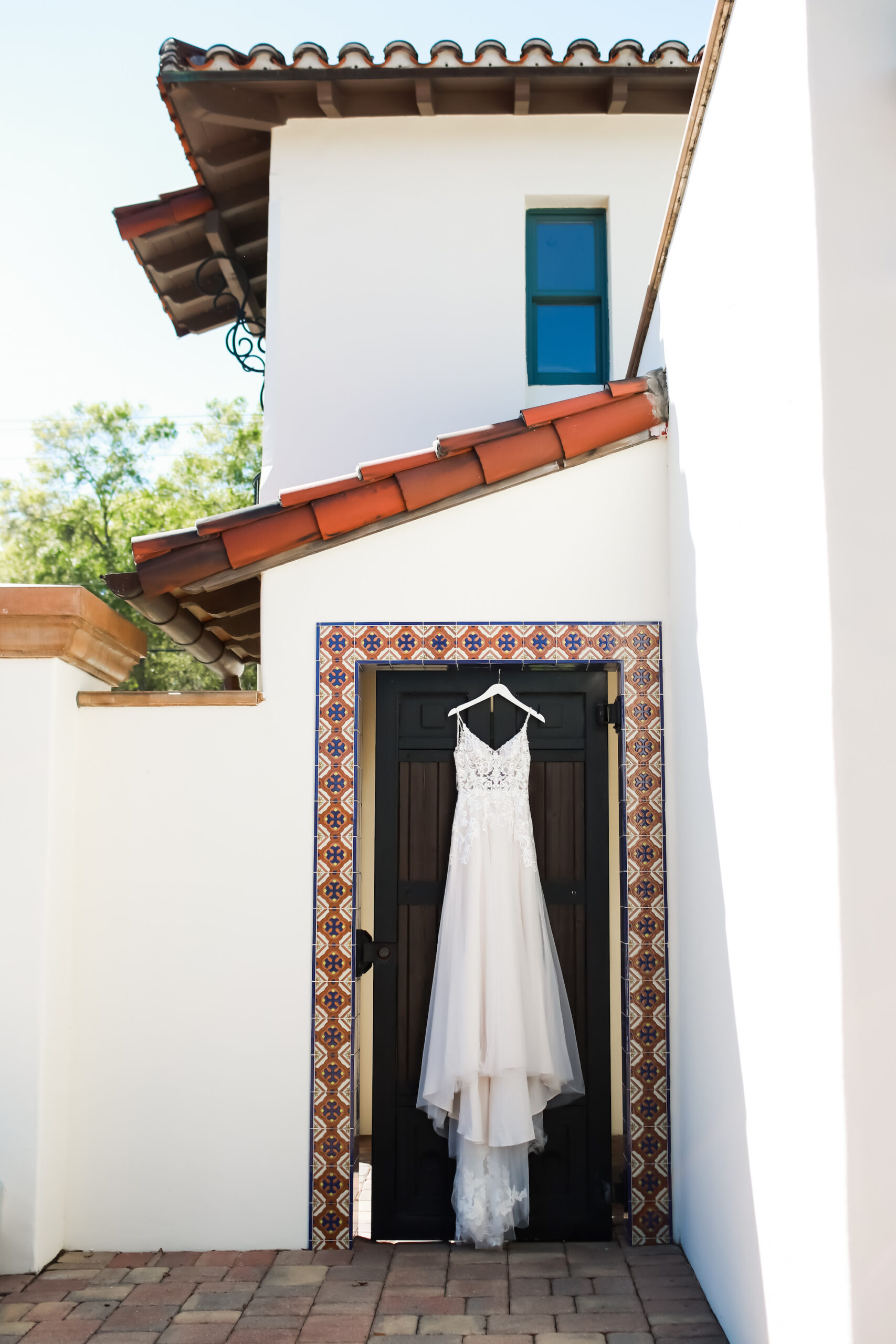 Wedding Dress Hanging in the Doorway | Tampa Wedding Dress Boutique Truly Forever Bridal