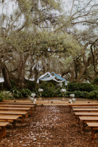 The Broken Oak Outdoor Wedding Ceremony | Round Gold Circle Metal Arch With Blue and White Drapery | Tampa Bay Venue Mill Pond Estate