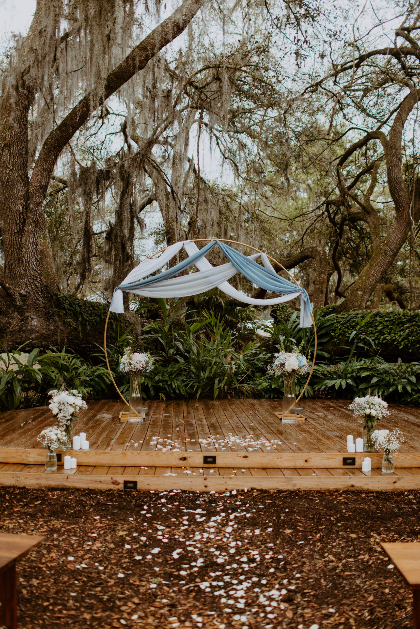 Timeless Blue and White Wedding Altar Inspiration | Outdoor Wedding Ceremony | Round Gold Circle Metal Arch With Blue and White Drapery | Tampa Bay Venue Mill Pond Estate