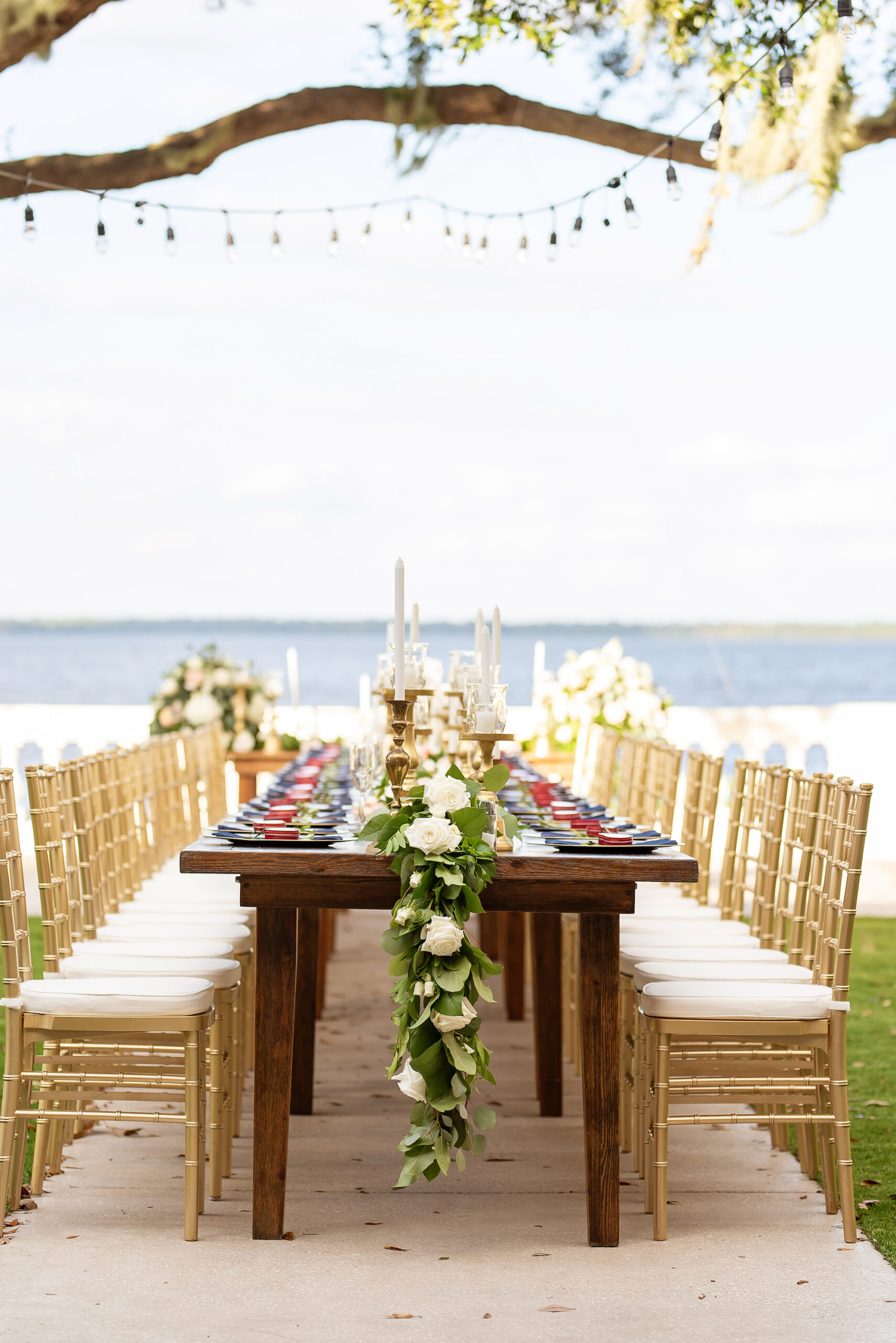 Italian-Inspired Wedding Decor Inspiration | Long Feasting Table for Intimate Wedding Reception | Gold Chiavari Chairs with Cushion | Cascading Rose and Eucalyptus Greenery Centerpiece Ideas
