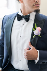 Navy and Black Wedding Tuxedo with Black Bowtie Inspiration with Pastel Pink and Purple Boutonniere | Florist Save the Date Florida