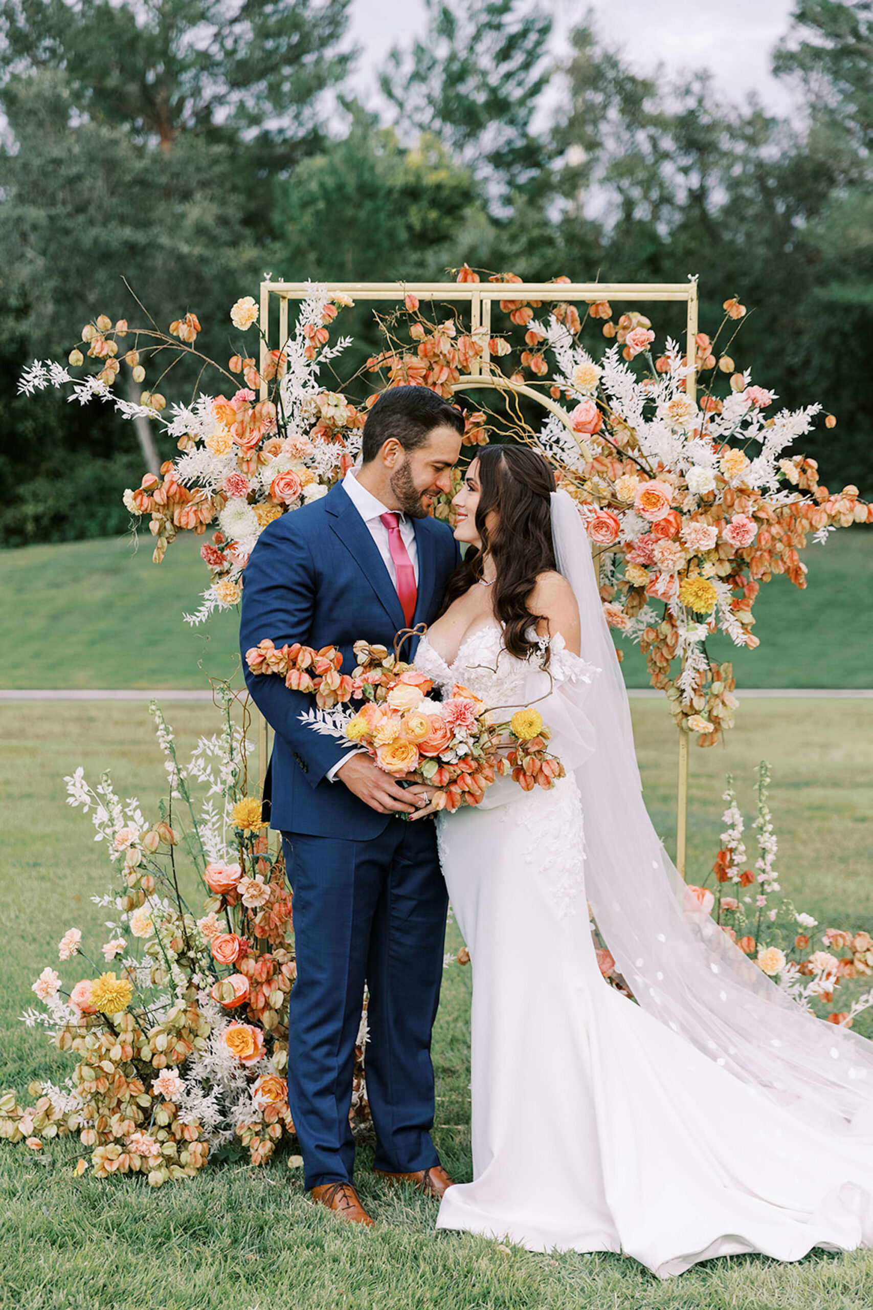 Gold Wedding Ceremony Arch with White, Pink, Peach, and Yellow Flower Arrangement Ideas | Spring Wedding Inspiration | Tampa Bay Planner MDP Events | Venue Whitehurst Gallery