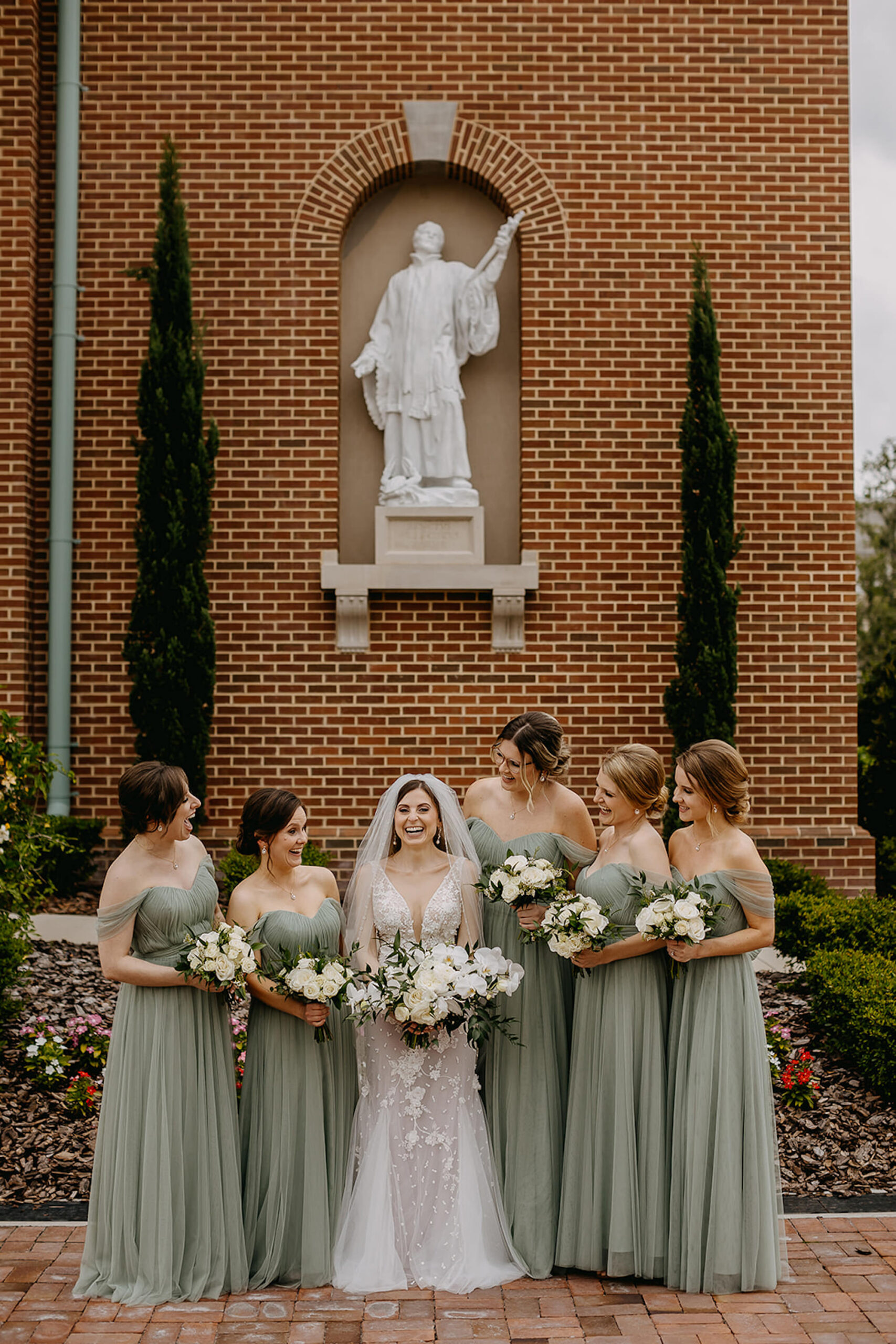 Matching Off-the-shoulder Sage Green Floor Length Tulle Bridesmaid Dress Inspiration | White Orchid and Rose with Ruscus Greenery Bridal Bouquet | Tampa Bay Florist Monarch Events and Design