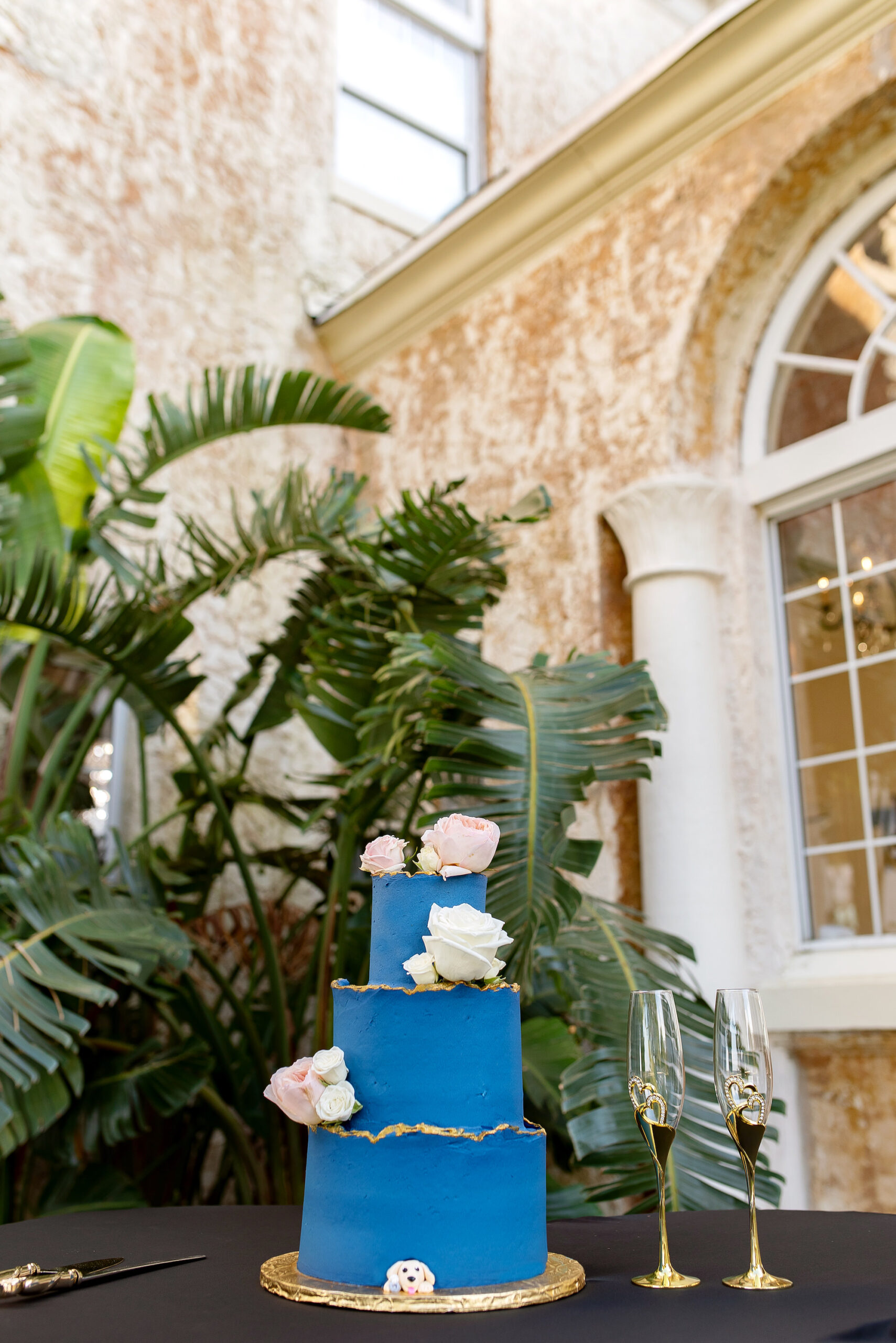 Vibrant Three-tiered Blue and Gold Wedding Cake Inspiration with Pink and White Garden Roses