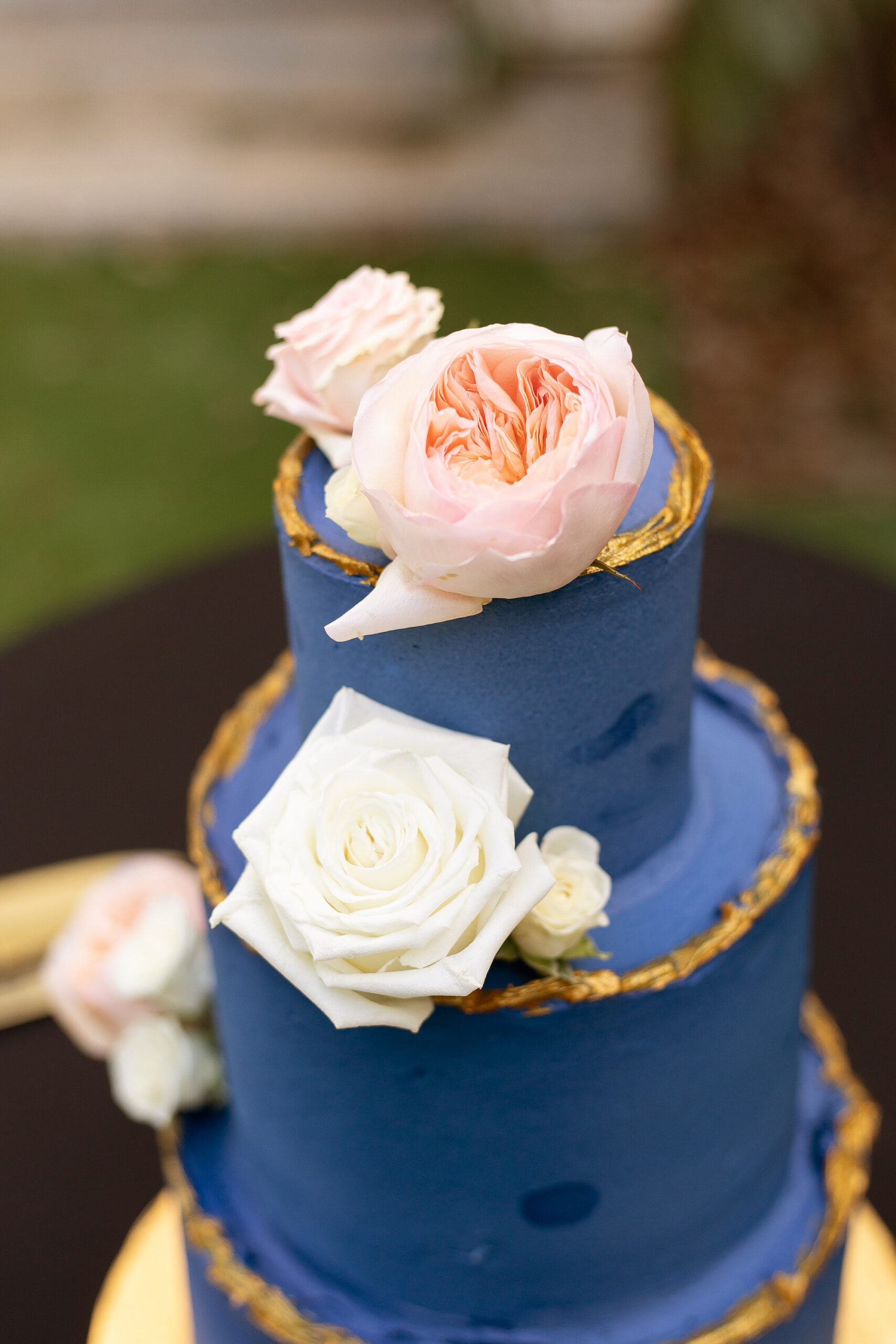 Three-tiered Dark Blue and Gold Wedding Cake Inspiration with Pink and White Garden Roses | Unique Wedding Cake Ideas