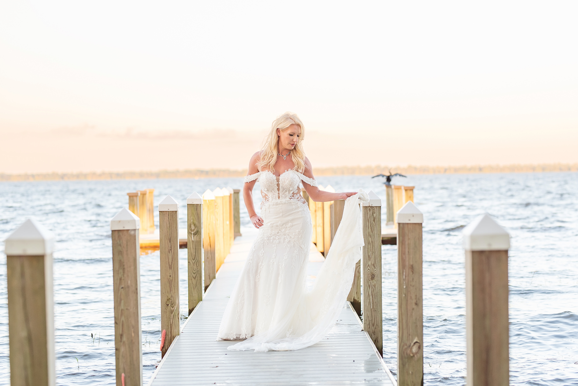 Bride on Dock Wedding Portrait | Lake Wales Venue Bella Cosa | Tampa Bay Wedding Photographer Kristen Marie Photography