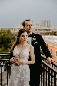 Romantic Bride and Groom Balcony Wedding Portrait Overlooking Downtown Tampa | Venue Hotel Haya
