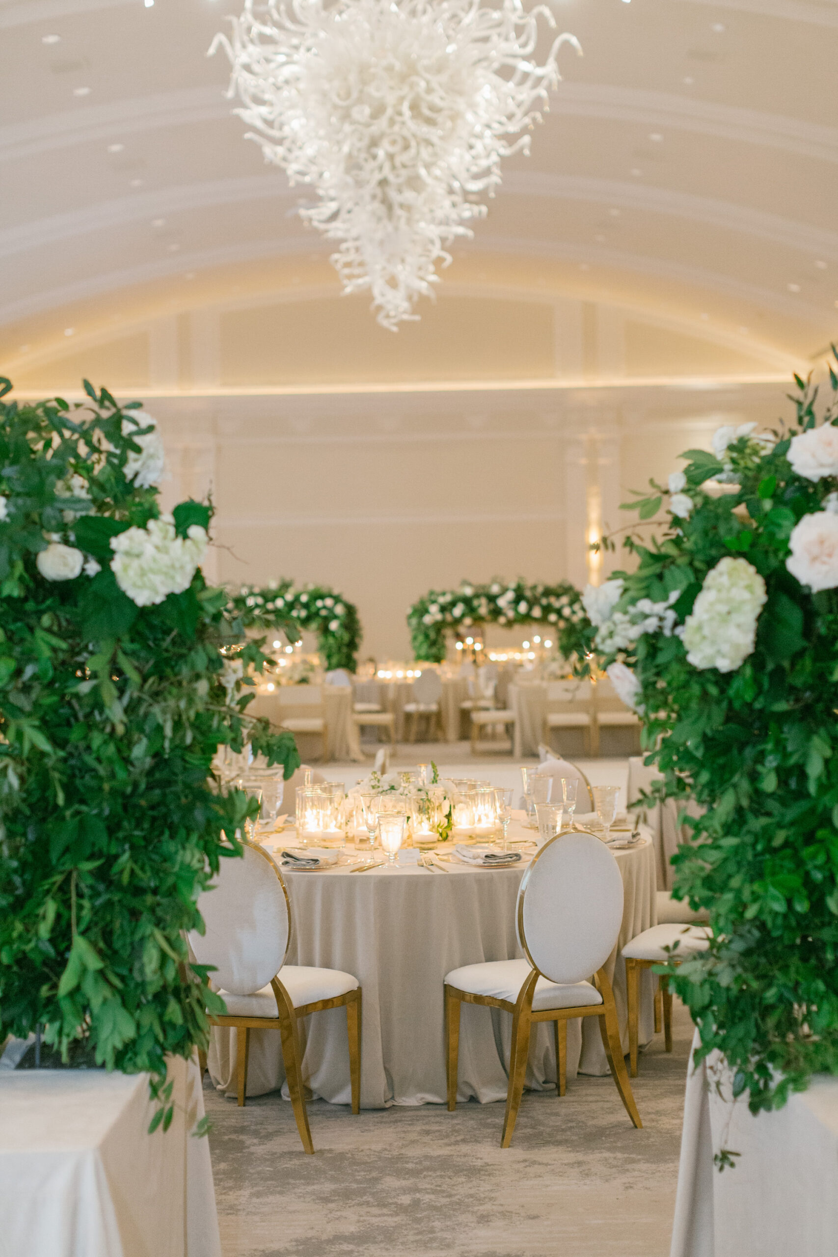 Luxurious Ballroom Wedding Reception Inspiration | Greenery Centerpiece Reception Ideas | Modern White and Gold Chair Seating Ideas | A Chair Affair