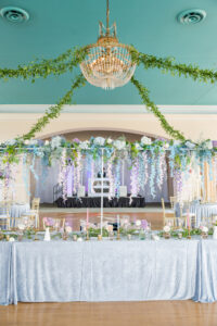 Spring Pastel Blue and Purple Cascading Flowers Over Long Feasting Table Inspiration | Tampa Florist Save the Date Florida | Ybor City Venue The Cuban Club