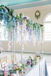 Spring Garden Inspired Pink and Blue Cascading Wisteria and Purple Hydrangreas Wedding Sweetheart Table Floral Arrangement Ideas | Tampa Florist Save the Date Florida