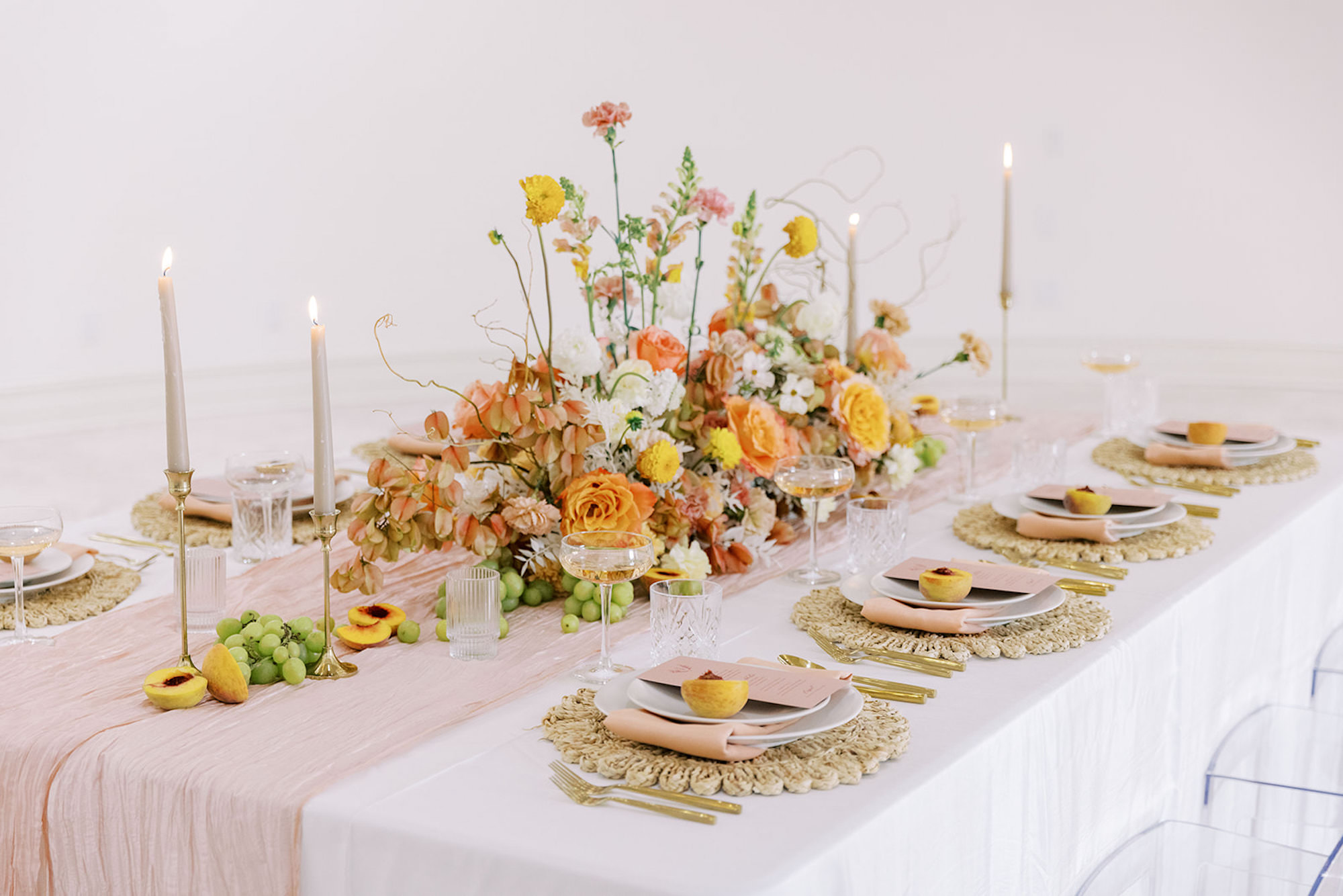 Yellow, Orange, and Pink Garden Rose Dahlia, and Wildflower Romantic Wedding Reception Centerpiece Ideas | Gold Flatware | White Tablecloth Linen | Individual Menu Inspiration | Hyacinth Placemat | Peach Themed Wedding Inspiration