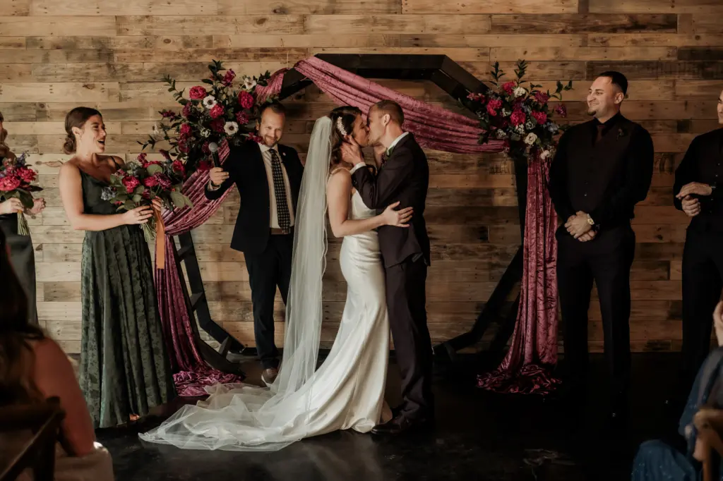 Dark and Moody Wedding Florals for Wooden Ceremony Arch and Purple Velvet Draping Ideas | Madeira Beach Venue The West Events