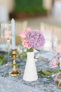 Pink Rose and Purple Star Flower Centerpiece Inspiration | Light Blue Taper Candle with Gold Holder