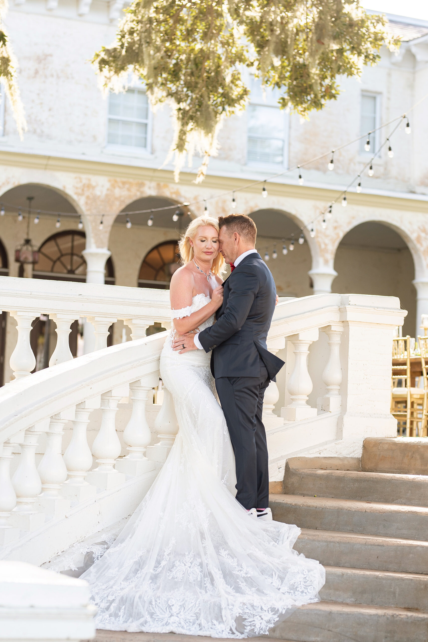 Outdoor Bride and Groom Wedding Portrait on Stairs at Italian Inspired Setting in Central Florida | Venue Bella Cosa | Tampa Bay Wedding Photographer Kristen Marie Photography