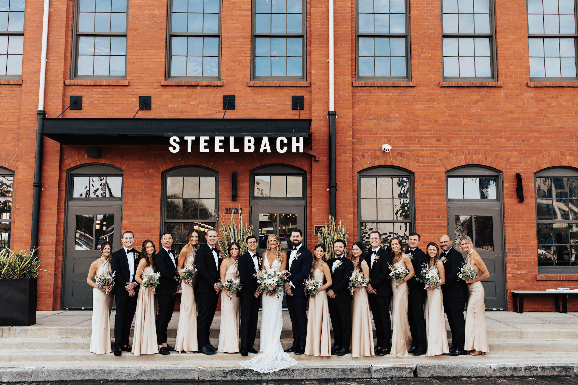 Black Tuxedo and Bowtie | Neutral Champagne Bridesmaid Dress Ideas | Tampa Bay Industrial Wedding Venue Ideas