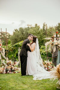 Bride and Groom First Kiss Wedding Portrait | Tampa Bay Wedding Venue Mision Lago | Planner EventFull Weddings