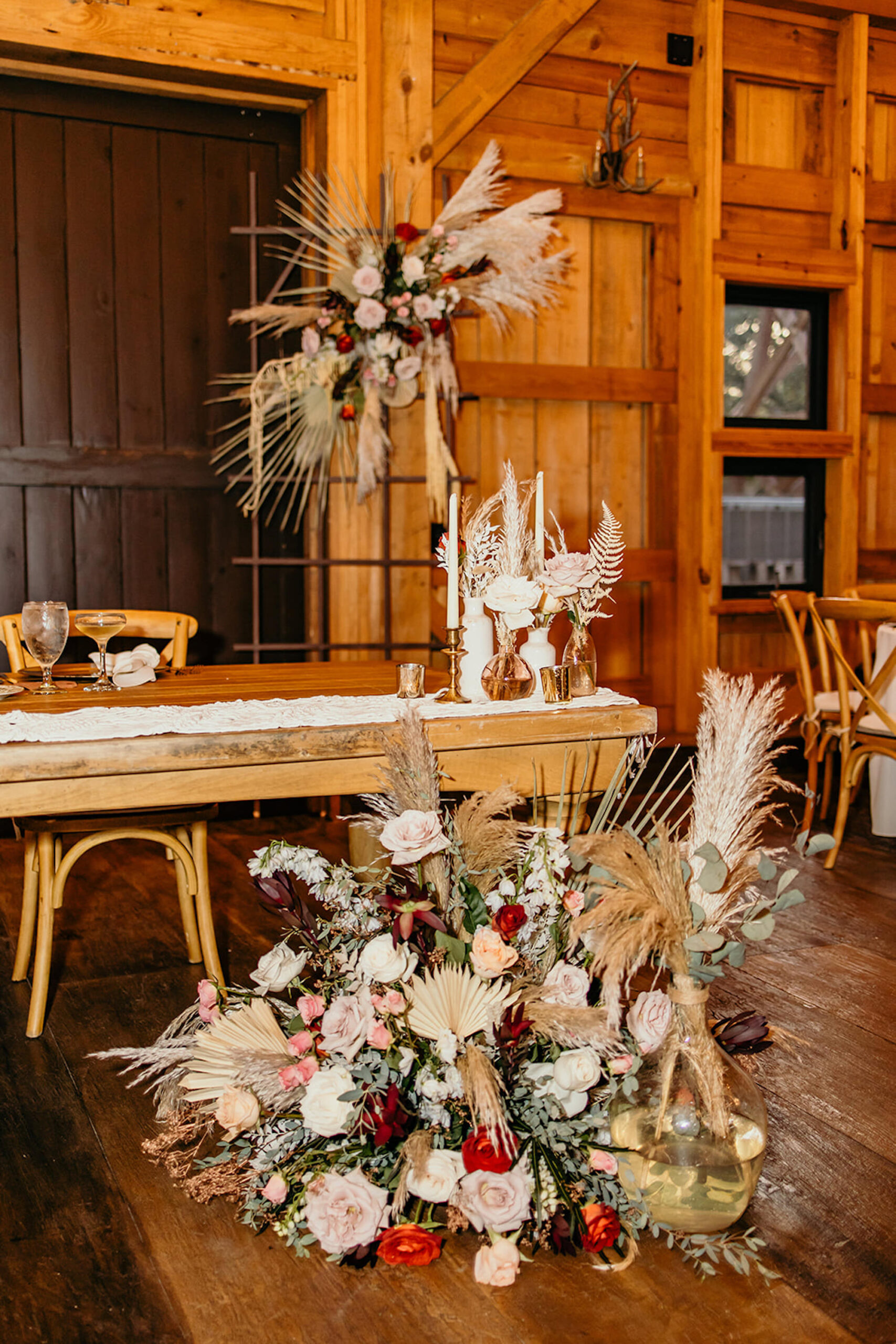 Boho Sweetheart Table Flower Inspiration | Fern, Pampas Grass, Palm Leaves, Eucalyptus, and Roses Floor and Backdrop Floral Arrangements | Tampa Bay Florist Save The Date Florida