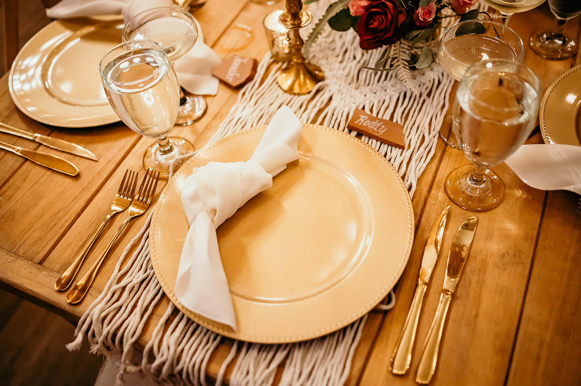 Boho Wedding Reception Table Decor Inspiration | Gold Chargers and Flatware | Terracotta Place Cards | Macrame Table Runner