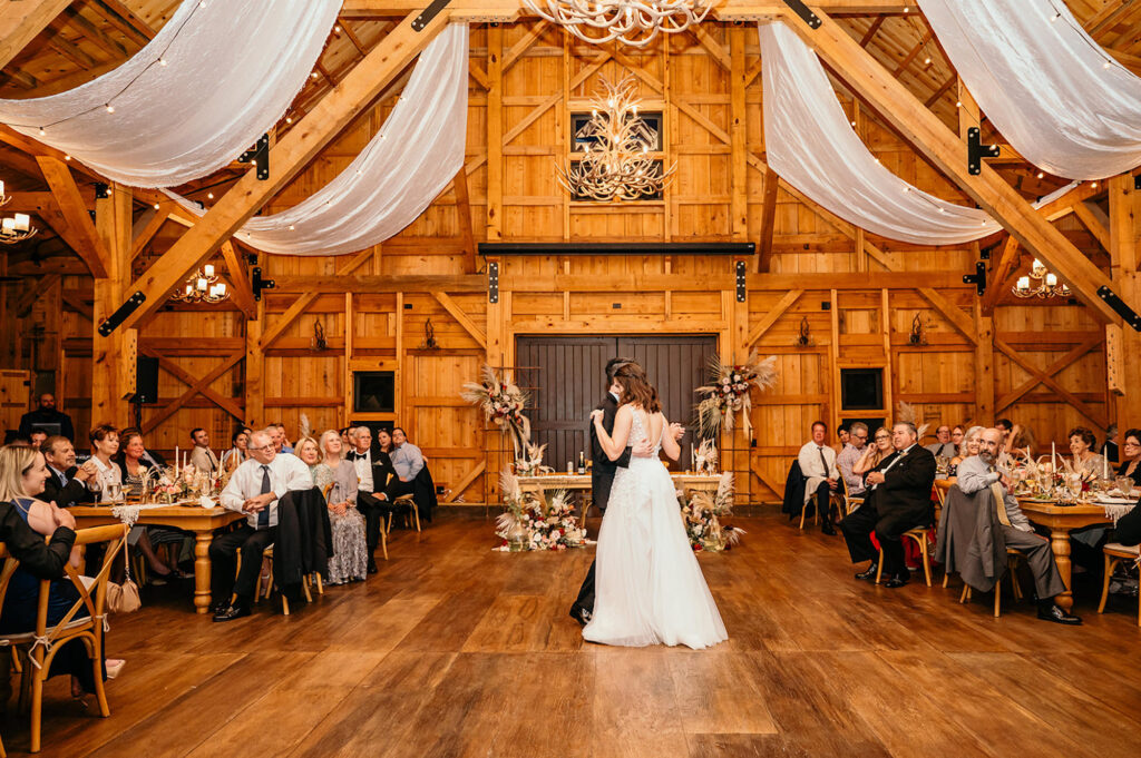 Bride and Groom First Dance Wedding Portrait | Antler Chandelier | Rustic Tampa Bay Venue Mision Lago Estate | Draping Gabro Event Services