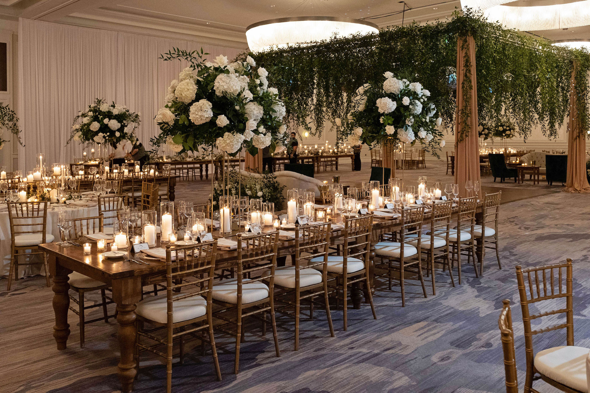 Greenery Floral Chandelier | Long Feasting Tables | Candlelit Centerpieces Ideas | St. Pete Wedding Florist Bruce Wayne Florals | Chairs A Chair Affair