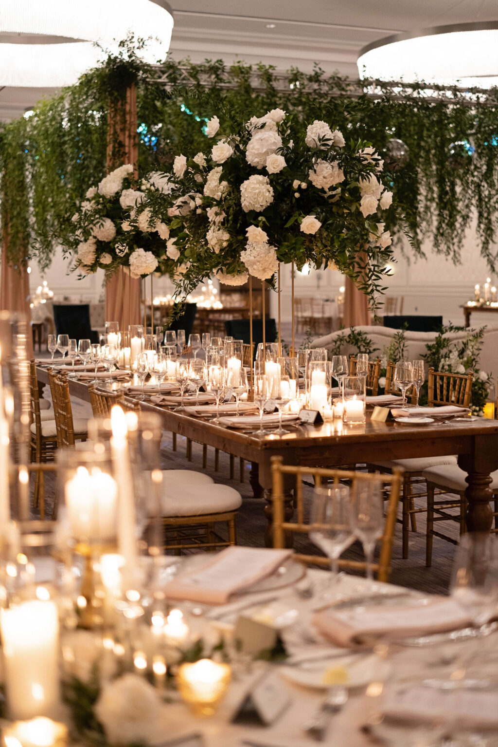 Greenery Floral Chandelier | Long Feasting Tables | Candlelit Centerpieces Ideas | St. Pete Wedding Florist Bruce Wayne Florals
