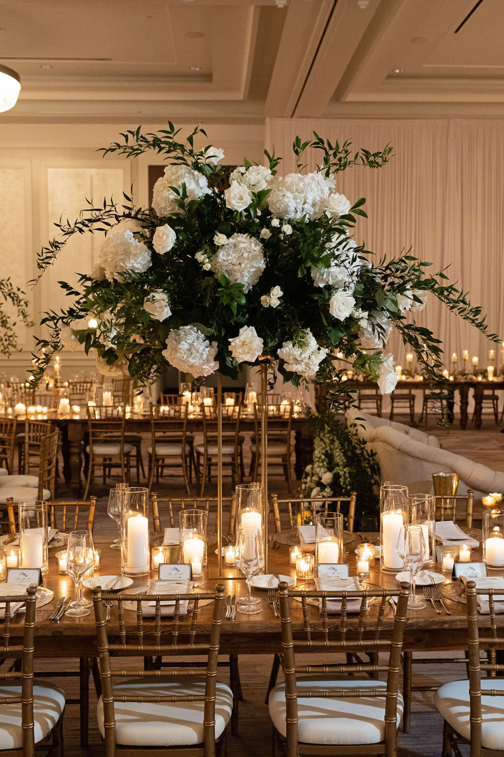 Elegant White Hydrangea and Rose Floral Arrangements with Ruscus Greenery | Candlelit Centerpieces | St. Pete Florist Bruce Wayne Florals