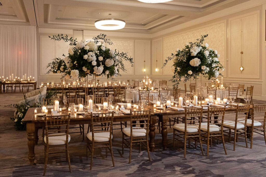 Elegant White Hydrangea and Rose Floral Arrangements with Ruscus Greenery | Candlelit Centerpieces | Tampa Bay Rental Company A Chair Affair | Florist Bruce Wayne Florals