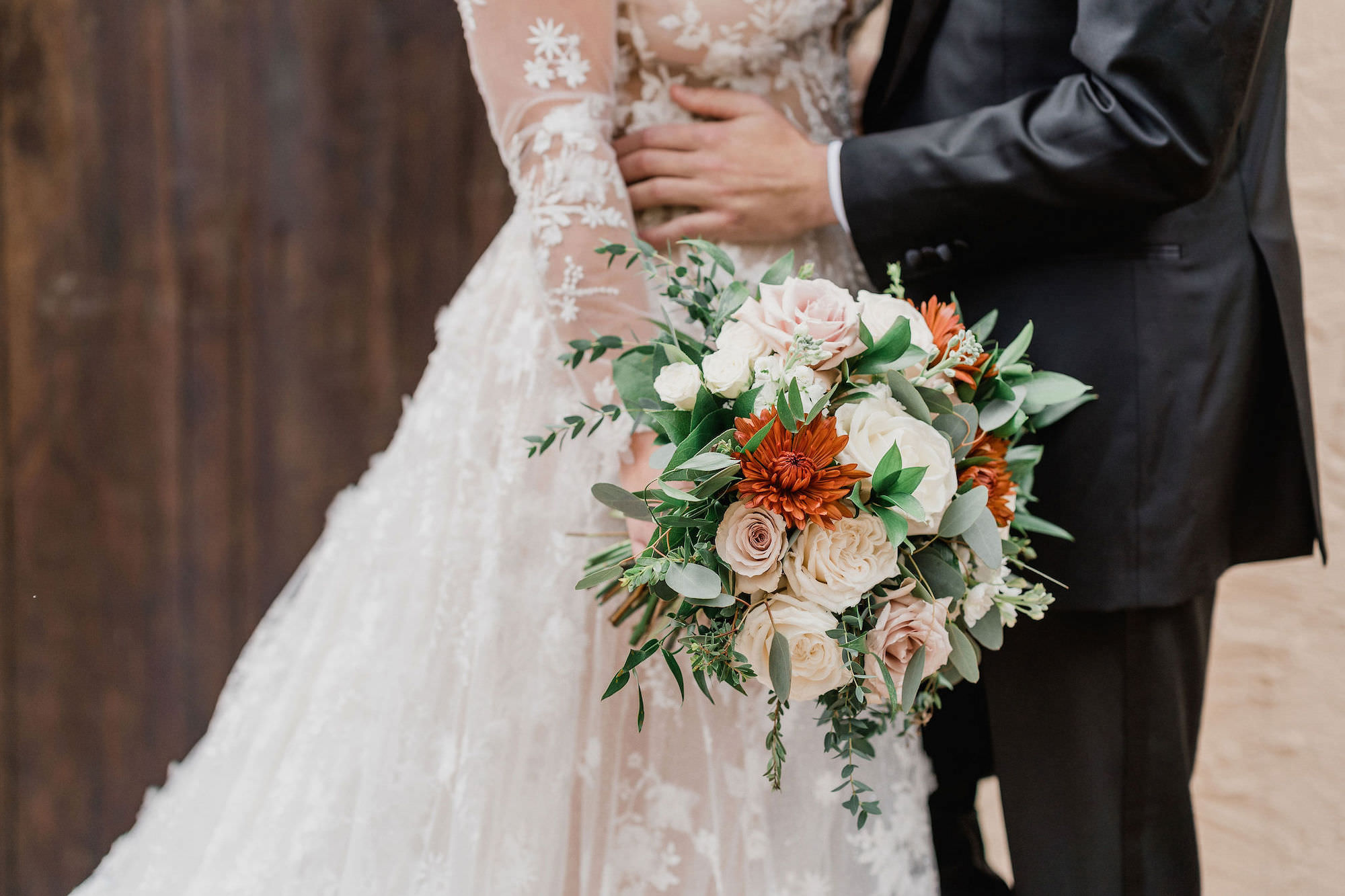White and Pink Roses, Orange Chrysanthemum, Ruscus, and Eucalyptus Bridal Wedding Bouquet Ideas | Sarasota Florist Monarch Events and Design