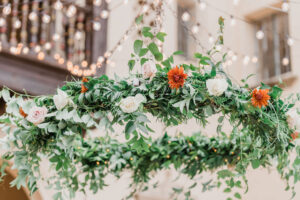 Greenery with White Roses and Orange Chrysanthemum Flower Chandelier | Sarasota Florist Monarch Events and Design