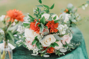 White and Pink Roses, Orange Chrysanthemum, Ruscus, and Eucalyptus Bridal Wedding Bouquet | Sarasota Florist Monarch Events and Design