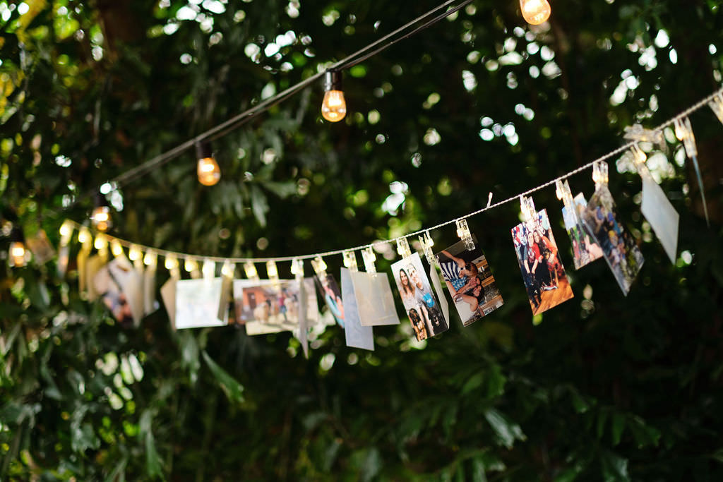 Clothesline Picture Display at Wedding Reception Inspiration