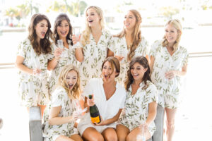 Bride Getting Ready with Bridesmaids Wedding Portrait | Matching Boho White and Greenery Pajamas Inspiration | St. Pete Beach Hair and Makeup Artist Femme Akoi Beauty Studio
