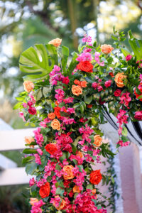 Pink Bougainvillea, Orange and Red Roses, Monstera Wedding Chuppah Floral Arrangement Ideas