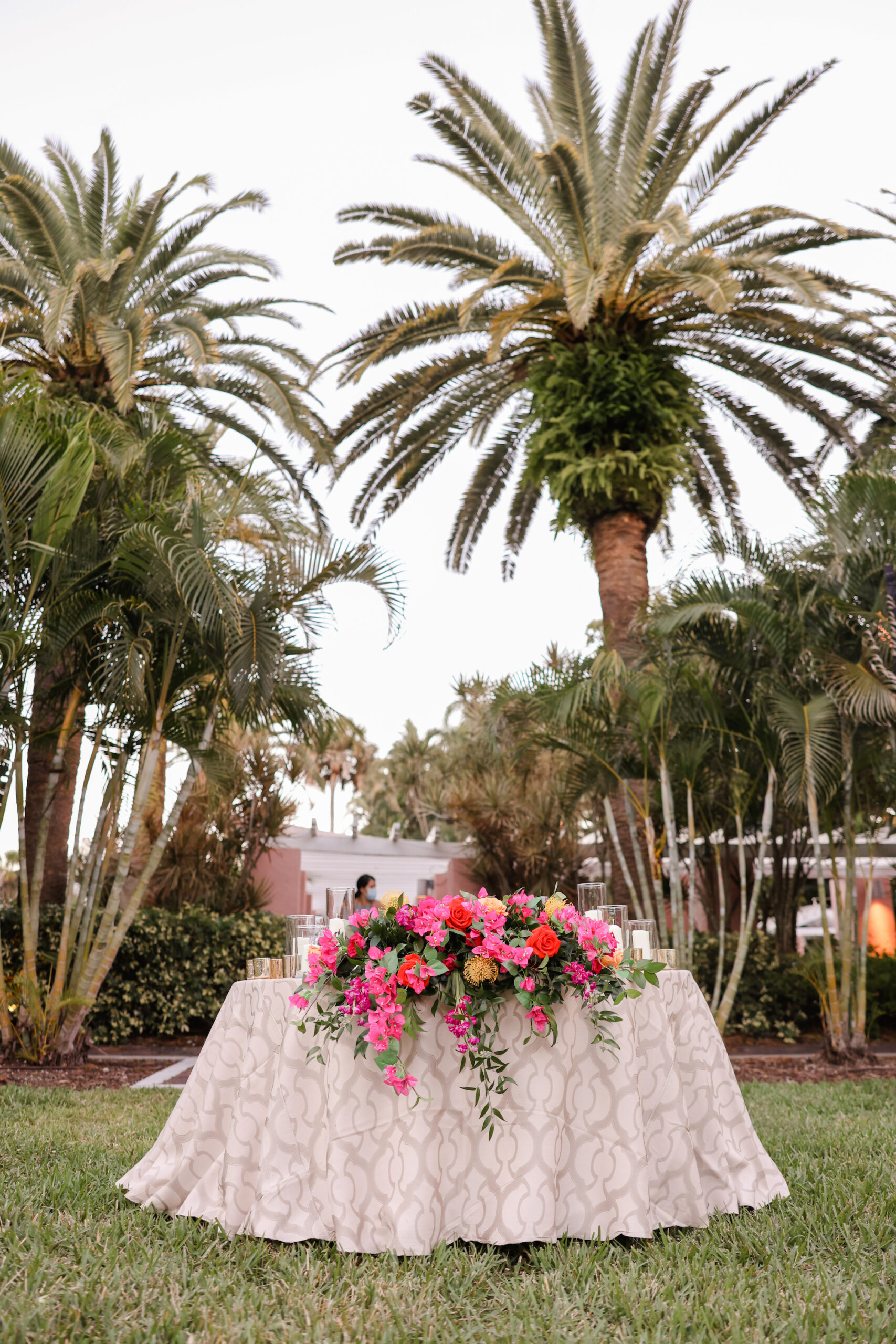 Sweetheart Table with Champagne Linen and Tropical Flower Table Spray Inspiration
