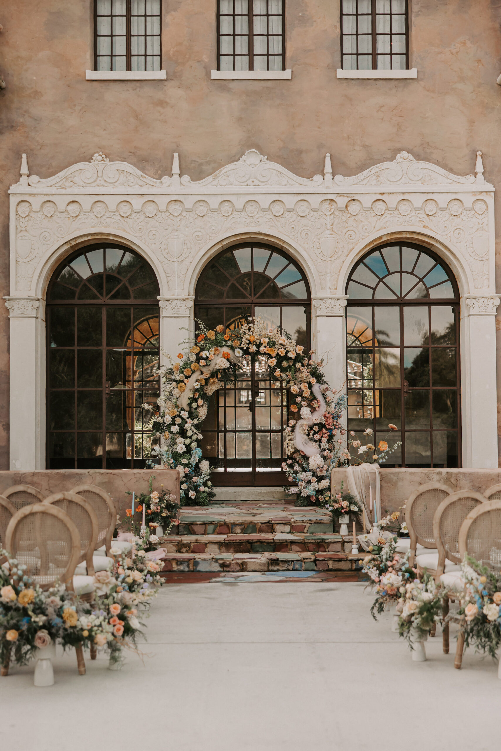 Garden Ombre Rainbow Floral Ceremony Arch for Italian Mansion Style Wedding Ceremony | Decor Inspiration