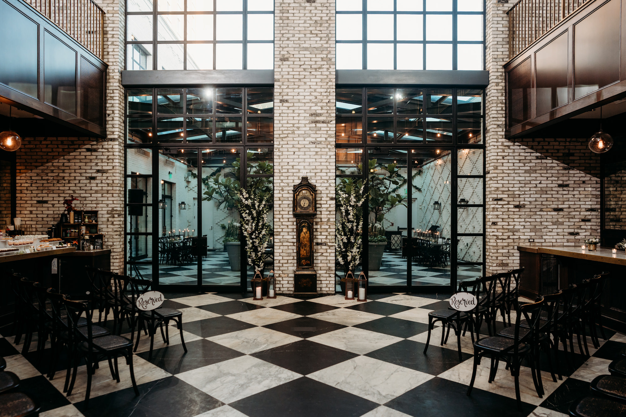 Timeless Indoor Wedding Ceremony with Black Chairs and Checkered Floor | Venue Oxford Exchange | Tampa Florida Event Planner Special Moments