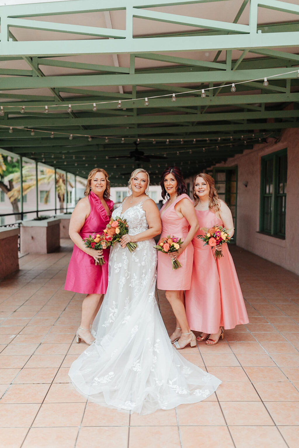 Bride with Bridesmaids in Mix and Match Long and Short Bright Pink Tropical Florida Bridesmaids Wedding Dresses | St Petersburg Hair and Makeup Femme Akoi