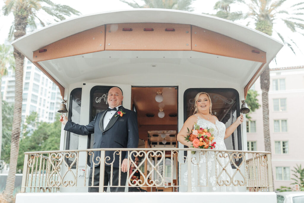 Bride and Groom on White Transportation Trolley
