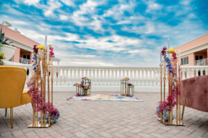 Vibrant Pink Baby's Breath, Blue and Red Snapdragon | Gold Cluster Taper Candle Holder Ceremony Aisle Decor | Tampa Bay Florist Save the Date Florida