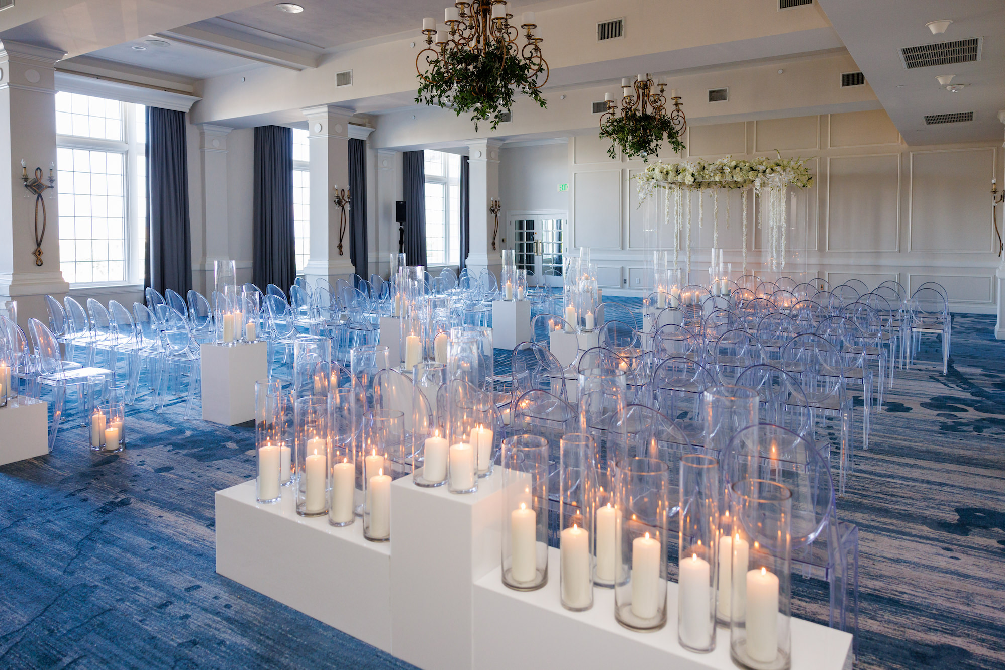 Modern Timeless Candlelit Wedding Aisle Ceremony Decor | White Pillar Candles | Ghost Acrylic Chairs Seating Inspiration | Buena Vista Ballroom Wedding Ceremony at St Pete Venue Don CeSar