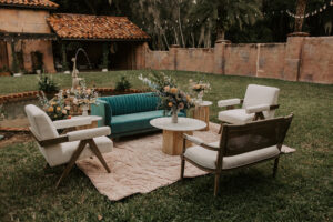 Cocktail Hour Lounge Velvet Emerald Green Sofa and White Chairs in Wedding Venue Courtyard Ideas