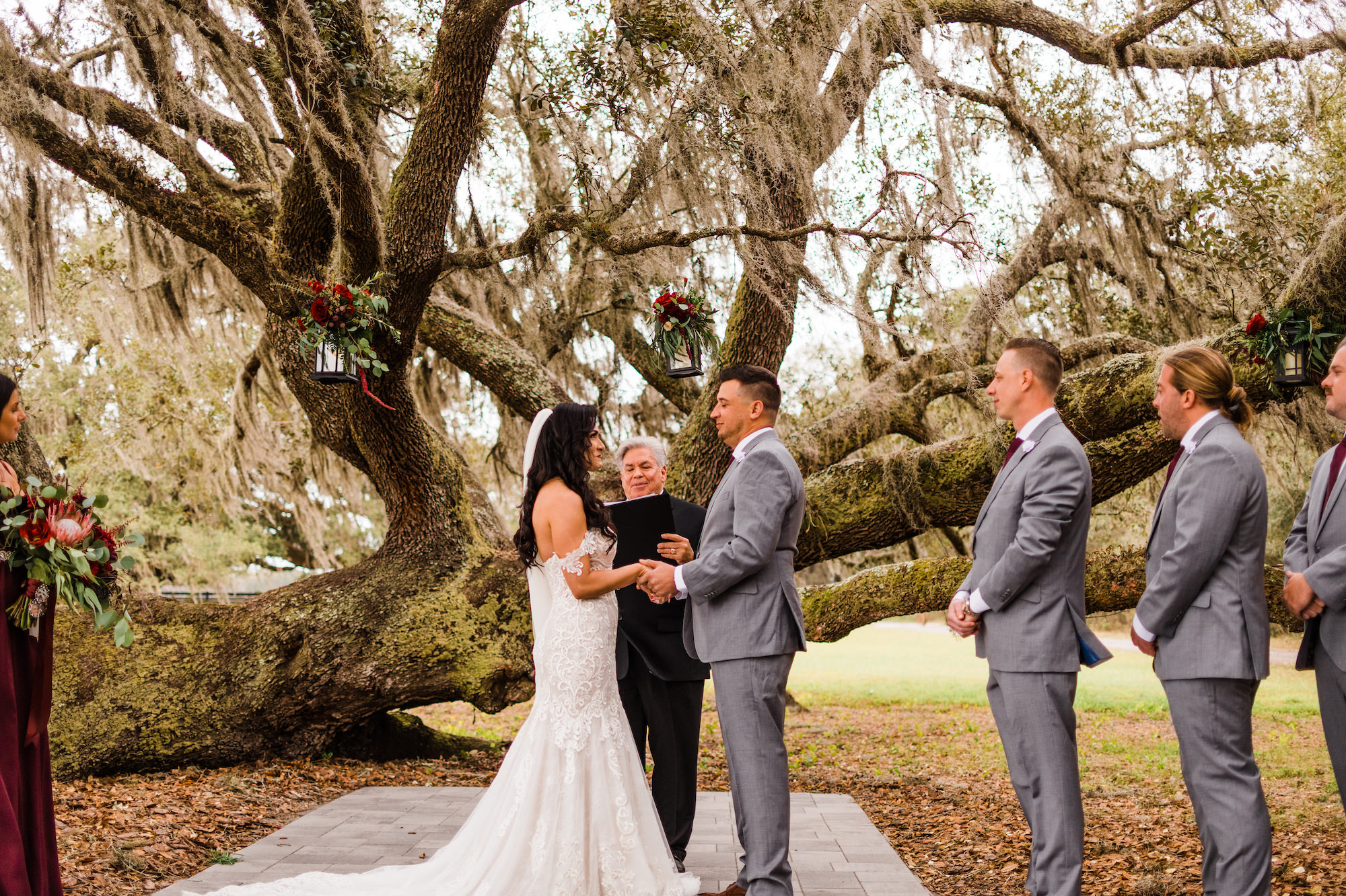 Bride and Groom Exchanging Vows | Grand Oak Tree Wedding Ceremony | Outdoor Nature Inspired Minimalist Decor