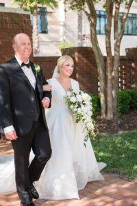 Bride and Father Walking Down Wedding Aisle